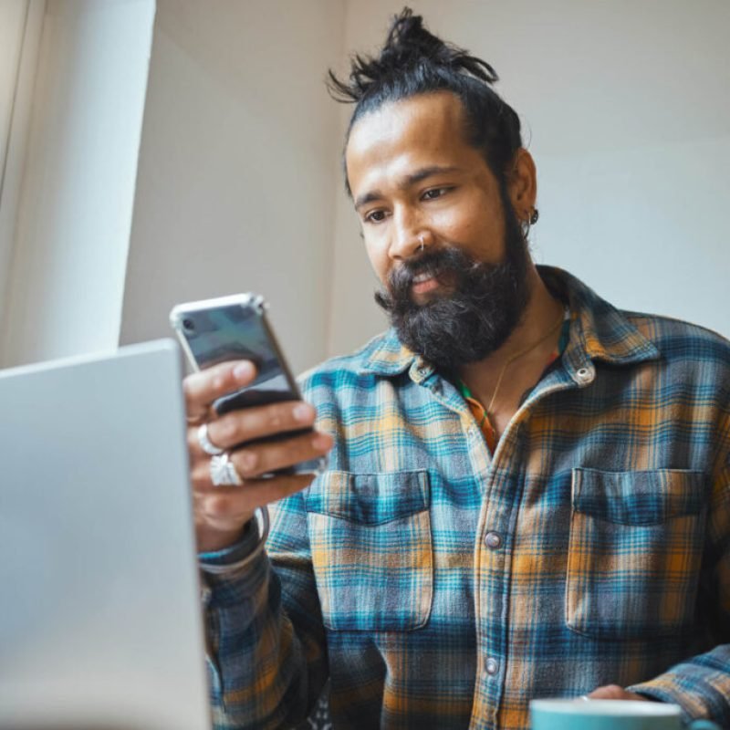 remote-work-phone-or-cafe-man-on-laptop-planning-o-2N79FKM-1024x683 (1)